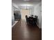 Dining area featuring wood floors, a chandelier, and sliding glass doors for ample natural light at 1238 Lakecrest Dr, Apopka, FL 32703
