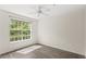 Bedroom with large window, allowing ample sunlight and wood-look flooring at 12843 Madison Pointe Cir # 106, Orlando, FL 32821