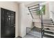 Outdoor entryway featuring a black door and stairs at 12843 Madison Pointe Cir # 106, Orlando, FL 32821