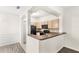 View of the kitchen with cabinets and black appliances at 12843 Madison Pointe Cir # 106, Orlando, FL 32821