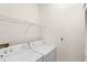 Laundry room with shelving and washer and dryer at 12843 Madison Pointe Cir # 106, Orlando, FL 32821