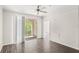 Spacious living room featuring wood-look floors and natural light at 12843 Madison Pointe Cir # 106, Orlando, FL 32821
