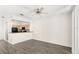 Living room with wood floors open to the kitchen at 12843 Madison Pointe Cir # 106, Orlando, FL 32821