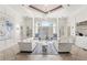 An elegant lobby with soaring ceiling, decorative rug, couches, and oversized windows at 12843 Madison Pointe Cir # 106, Orlando, FL 32821