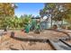 Community playground surrounded by mature landscaping, offering fun for all ages at 12843 Madison Pointe Cir # 106, Orlando, FL 32821