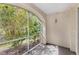Relaxing screened porch with garden view for enjoying the outdoors comfortably at 12843 Madison Pointe Cir # 106, Orlando, FL 32821