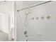Bathroom shower and tile design with a view to vanity and bedroom at 12843 Madison Pointe Cir # 106, Orlando, FL 32821