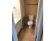 Compact bathroom featuring toilet, vanity, and built-in storage for toiletries at 133 Oyster Bay Cir # 330, Altamonte Springs, FL 32701