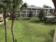 Exterior view of a community with buildings and a large green common area at 133 Oyster Bay Cir # 330, Altamonte Springs, FL 32701
