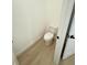 Bathroom featuring modern toilet and light wood flooring at 14145 Sw 47Th Ave, Ocala, FL 34481