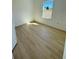 Bedroom with light wood flooring and natural light at 14145 Sw 47Th Ave, Ocala, FL 34481