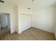 Bedroom featuring closet and light wood flooring at 14145 Sw 47Th Ave, Ocala, FL 34481