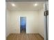 Empty room featuring recessed lighting, baseboard trim and wood look floors and an open door frame at 14145 Sw 47Th Ave, Ocala, FL 34481