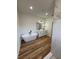 A luxurious bathroom showcasing a soaking tub, walk-in shower, and double sink vanity at 15164 Sw 46Th Cir, Ocala, FL 34473