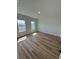 Bright bedroom with wood floors, two large windows, and recessed lighting at 15164 Sw 46Th Cir, Ocala, FL 34473