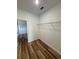 A spacious closet features wood-look floors and wire shelving for ample storage at 15164 Sw 46Th Cir, Ocala, FL 34473