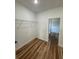 A spacious closet features wood-look floors and wire shelving for ample storage at 15164 Sw 46Th Cir, Ocala, FL 34473