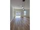 Bright, airy living space with sliding glass doors, modern lighting fixtures, and sleek floors at 15164 Sw 46Th Cir, Ocala, FL 34473