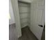 Well-organized closet features wire shelving for ample storage and easy organization at 15259 Sw 51St Cir, Ocala, FL 34473