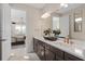 Beautiful bathroom with double vanity, granite countertops and a view to the Main Bedroom at 15335 Rising View Dr, Montverde, FL 34756