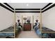Nicely decorated bedroom for two featuring twin beds and dark ceiling stripes at 15335 Rising View Dr, Montverde, FL 34756