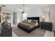 Beautifully designed bedroom with a luxurious bed, stylish decor, and ample natural light at 15335 Rising View Dr, Montverde, FL 34756