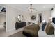 Elegant bedroom featuring a dresser, modern lighting, and neutral decor at 15335 Rising View Dr, Montverde, FL 34756