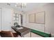 Cozy flex room featuring a desk, putting green, modern decor, and ample natural light at 15335 Rising View Dr, Montverde, FL 34756