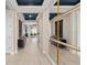 Modern foyer featuring tiled floors, high ceilings, stylish mirror, and decorative accents at 15335 Rising View Dr, Montverde, FL 34756