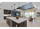 Modern kitchen with a large island, stainless steel appliances, and an open layout at 15335 Rising View Dr, Montverde, FL 34756