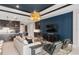 Stylish open-concept living area featuring blue ceiling, dark cabinets and modern furnishings at 15335 Rising View Dr, Montverde, FL 34756
