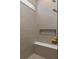 Tiled shower with a built-in bench and niche, showcasing modern design and functionality at 15335 Rising View Dr, Montverde, FL 34756