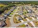 Aerial view of a residential area showcasing manicured lawns and community landscaping at 1816 Forest Glen Dr, Fruitland Park, FL 34731