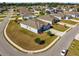 Aerial view of a well-kept single-Gathering home in a suburban neighborhood on a large lot at 1816 Forest Glen Dr, Fruitland Park, FL 34731