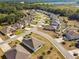 Picturesque aerial view of a well-planned residential community with winding roads and manicured lawns at 1816 Forest Glen Dr, Fruitland Park, FL 34731