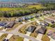 Overhead shot showcases a suburban neighborhood with well-spaced homes and green surroundings at 1816 Forest Glen Dr, Fruitland Park, FL 34731