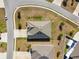 Overhead view of a suburban property featuring a well-manicured lawn and a wide driveway at 1816 Forest Glen Dr, Fruitland Park, FL 34731