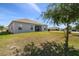 Spacious backyard with covered patio and ample space for outdoor activities at 1816 Forest Glen Dr, Fruitland Park, FL 34731