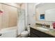 Inviting bathroom with tub/shower combo and granite countertop vanity at 1816 Forest Glen Dr, Fruitland Park, FL 34731