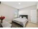 Cozy bedroom with a queen sized bed, a window, and ample natural light at 1816 Forest Glen Dr, Fruitland Park, FL 34731