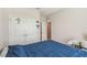 Bedroom featuring neutral walls, double door closet, and access to ensuite at 1816 Forest Glen Dr, Fruitland Park, FL 34731