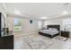 Spacious bedroom with tray ceiling, natural light, and ample closet space at 1816 Forest Glen Dr, Fruitland Park, FL 34731