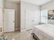 Relaxing bedroom featuring a double door closet and a bright, sunny window at 1816 Forest Glen Dr, Fruitland Park, FL 34731