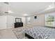 Large bedroom with tray ceiling, natural light, and ample closet space at 1816 Forest Glen Dr, Fruitland Park, FL 34731