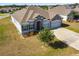 Charming single-Gathering home with stone accents and a well-manicured lawn at 1816 Forest Glen Dr, Fruitland Park, FL 34731