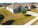 A well-manicured home showcases stone accents, a two-car garage, and a neatly landscaped front yard at 1816 Forest Glen Dr, Fruitland Park, FL 34731