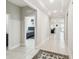 Inviting hallway with tray ceiling leads to bedrooms and living area with nice floor and wall trim at 1816 Forest Glen Dr, Fruitland Park, FL 34731