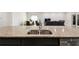 Open concept kitchen with island sink, granite countertops, and view to the dining and living area at 1816 Forest Glen Dr, Fruitland Park, FL 34731