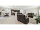 The expansive living room connects to the kitchen and offers ample seating and natural light at 1816 Forest Glen Dr, Fruitland Park, FL 34731