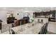 Open-concept living area with modern kitchen, dining space and comfortable seating at 1816 Forest Glen Dr, Fruitland Park, FL 34731